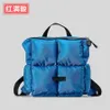 Un sac à dos à carreaux en toile de niche avec un sac à main en coton remplissant élégant et minimaliste et un sac à dos de voyage en plein air de grande capacité 240402