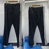 Pantalons pour hommes Marque de mode Aiguilles Casual Papillon Brodé Côté Bouton Rayé Noir Haute Qualité Pantalon Long Hommes Femmes