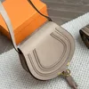 Designer Saddle Bag Luxurious Leather Quality Women's Shoulder Bag with Rivet Decoration and Horseshoe-shaped Handbag