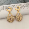 Boucles d'oreilles pendantes pour femmes, Design Unique, cerceau de verrouillage de couleur or, petites épingles de sécurité, bijoux minimaux