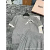 24 early spring new diamond grid short sleeved pullover top? Half skirt two-piece set for fashionable casual and sweet style