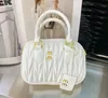 2024 Fashion Miui Shoulder Bag Mattilas Bowling Women's Wandering Luxury Handbag Slant Body Cosmetics Women's Designer Handbag Leather Clutch bag