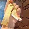 Ny kreativ frukt canvas skor 3d nyckelring par skolväska hänge bil nyckelchain dollmaskin gåva