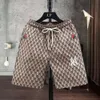 Heren shorts mode -label geborduurd vijf delige camouflage bedrukte casual broek, zomer snel drogende strandbroek