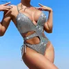 Kvinnors badkläder glitter glittrande silver klippt ut monokini baddräkt en bit badkläder kvinnor 2024 sexig simning slitage baddräkt bodysuit bather y240402