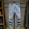 Jeans strappati a 9 punti estate per ragazzi, leggings allentati, versione coreana di abiti da lavoro di marca alla moda, pantaloni per gambe artne