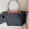 2024 New Designer Nylon Crossbody Bag Tote Dumpling Waterproof Handbag Womens Bag One Shoulder Commuting Bag New Travel Bag 10a