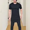 メンズTシャツの男性Tシャツソリッドカラーラウンドネックスリムフィットミッドレングススリーブ毎日服を着る不規則な裾の薄い夏のトップカレット