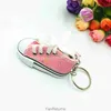 Mini -imitatie helder goud poeder canvas schoenen sleutelring hanger sportschoenen bagage auto hanger creatief cadeau