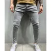 Cross grenziger europäischer und amerikanischer Emblem bestickter Männer Jeans mit Knie Tränen Reißverschluss kleine Füße Hosen Außenhandel große Denimhosen lila Jeans 422