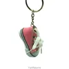 Mini -imitatie helder goud poeder canvas schoenen sleutelring hanger sportschoenen bagage auto hanger creatief cadeau