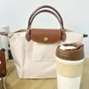 Designer tote bag Designer Women Occiglia Borse per laptop Scuola per la spiaggia Travel Nylon Borsa Borsa Borsa a tracota borse nere