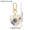 Blue Evil Eye Keychain alliage Righestone Palm Palle Pendre Key Ring Femmes Men Colorful Hollow Moon Coeur Charmes Lobster Backle Sac Car Clé ACCESSOIRES