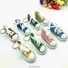 Mini -imitatie helder goud poeder canvas schoenen sleutelring hanger sportschoenen bagage auto hanger creatief cadeau