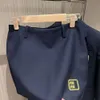 Tracksuit designer v-hals jacka kvinnor klänning sportkläder miu broderad kostym preppy stil kjol två bit set knapp cardigan päls