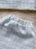 Robes de travail automne hiver sweet perles tweed deux pièces ensembles à plaid pour femmes simples à poitrine de veste à perles de veste et mini-jupe en laine