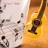 Tumblers 60 pçs / lote Novidade Estilos Música Nota Guitarra Cerâmica Copo Personalidade Leite Suco Caneca Café Chá Home Office Drinkware