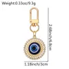 Tornario blu Evil Eye Keechain in lega di rinestone Sun Floro Round Ring Dare Donne Donni uomini colorati Cavali Cavalchi Araganna BASSO CUSCHLE ACCESSIONI CHIAVI CHIAVE BUT