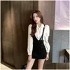 Robes de travail Femmes 2024 Spring Fashion White Shirt Black Suspender Jirt Suiwo Piece SetS Party Party Drop Livilor Apparel Vêtements DH3AJ