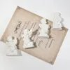 Dekorative Figuren kreative Luxus -Amor -Engel Statue Retro zarte friedliche Gebet Charakter Skulptur Gips Textur Aufnahmen Requisiten