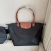 Neuer Designer Nylon Crossbody Bag Tote Maschine wasserdichte Handtasche Damenbeutel ein Schulterpendelbeutel neuer Reisetasche 1As