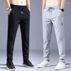 Calça masculina verão de verão macio casual fino e elasticidade de cor sólida apliques coreia cinza preto trabalho masculino calças de marca masculina