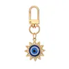 Tornario blu Evil Eye Keechain in lega di rinestone Sun Floro Round Ring Dare Donne Donni uomini colorati Cavali Cavalchi Araganna BASSO CUSCHLE ACCESSIONI CHIAVI CHIAVE BUT