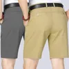 Shorts maschile uomini eleganti al ginocchio con tasche laterali di chiusura con cerniera per padre