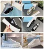 2024 New Luxury Sporty Leather Men Sneakers Shoes White Black Enameled-metal Triangle Rubber Soles Man Outdoor Trainers Comfort Walking Discount Foot