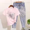 European Station Denim Set Women's Summer 2024 Nieuwe kralen geborduurde 3D Flower korte mouwen T-shirt+noodlijdende bijgesneden jeans