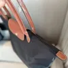 Neuer Designer Nylon Crossbody Bag Tote Maschine wasserdichte Handtasche Damenbeutel ein Schulterpendelbeutel neuer Reisetasche 1As