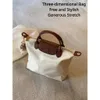 Kvinnors väska stor tote dumplings väska hösten 2023 handväska söt pendell axel crossbody väskor och handväskor lyxdesigner