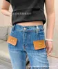 Designerin Nanyou High -End -Frauen neuer kleiner duftender Stil dünne Hochtaille und Fleischabdeckung Micro Horn Jeans für Frauen OSQT