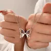 Colliers de pendentif 2pcs / ensemble Lovers Romantic Magnetic Couple Collier Micro Zircon Butterfly Pendre Clicule Chaîne d'amitié bijoux
