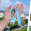 Decompressiespeelgoed Exquise Bear Barista Doll Keychain Milk Tea Cup Key Hangende sieraden ornamenten Kleine geschenken