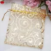 Enveloppe cadeau 100pcs / pack 12x9cm en or organza joelry pochette de mariage sac de faveur