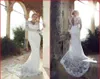 2015 Robes de mariée en dentelle transparente à manches longues V coupées de cou de gaine de gaine