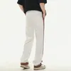 Design a strisce da uomo a strisce sciolte sciolte drappeggiatura a gamba larga hip hop personalità retrò di pantaloni casuali