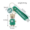 Decompressiespeelgoed Exquise Bear Barista Doll Keychain Milk Tea Cup Key Hangende sieraden ornamenten Kleine geschenken