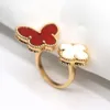 High -End -Temperament, vier Blattklee Schmetterlingsring, koreanische und gleichgültiger Stil von Frauen, Nischenleuchten, weiße Fritillaria offener Ring