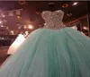 Nowe suknie balowe Mint Green Quinceanera Sukienki 2015 z tiulowymi koralikami Ruffe Sweetheart 15 Sukienki Słodkie 16 Suknie balowe QS279768023