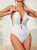 Swimwear femminile bianco White One Piece Swimsuit Solid V Neck Wrap Arround Out Tumum Control Abitutto da bagno Monokini senza schienale 2024