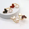 High -End -Temperament, vier Blattklee Schmetterlingsring, koreanische und gleichgültiger Stil von Frauen, Nischenleuchten, weiße Fritillaria offener Ring