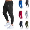 Pantalon pour hommes à crampons de couleur masculine conception de poche slim fit du logo de la couronne