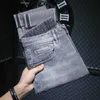 Mäns jeansdesigner High End tryckt cigarettgrå beskurna jeans herremärke varumärke mångsidig avancerad elastisk avsmalnande smala leggings 9 y7pu