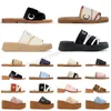 Kvinnans designer tofflor Woody Flat Mules Slides för kvinnliga sandaler Canvas Square Toe Lace broderi Sommar Sandalen Luxury Famous Beach Shoes Sliders 35-42