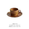 Koppar tefat keramiska präglade kaffekoppar och fat sätter avancerad utsökta europeiska retrostil frukostmjölk eftermiddagste