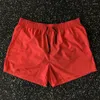 Esportes de shorts de shorts masculinos para homens e mulheres treinamentos elásticos, executando o fitness de três quartos do verão americano