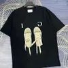 Designers masculinos e femininos de verão solto roupas de tamanho grande tops casuais letras camisetas shorts shorts roupas de manga de manga masculina t-shirts tulingzhu