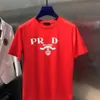 Camiseta de cuello redondo para hombres y mujeres de diseño combinada con una letra de Triángulo PR estampado suelto tendencia versátil y americana tendencia de algodón puro camiseta